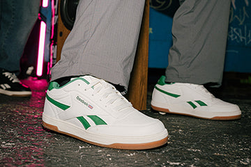 Reebok x Heelys roller shoes. White Heelys with green accents and Reebok flag branding.